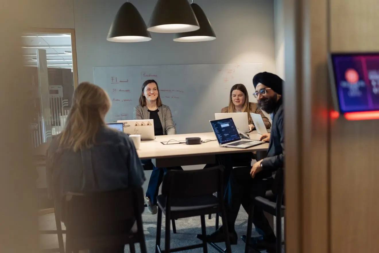 Team working in a Telia office meeting space